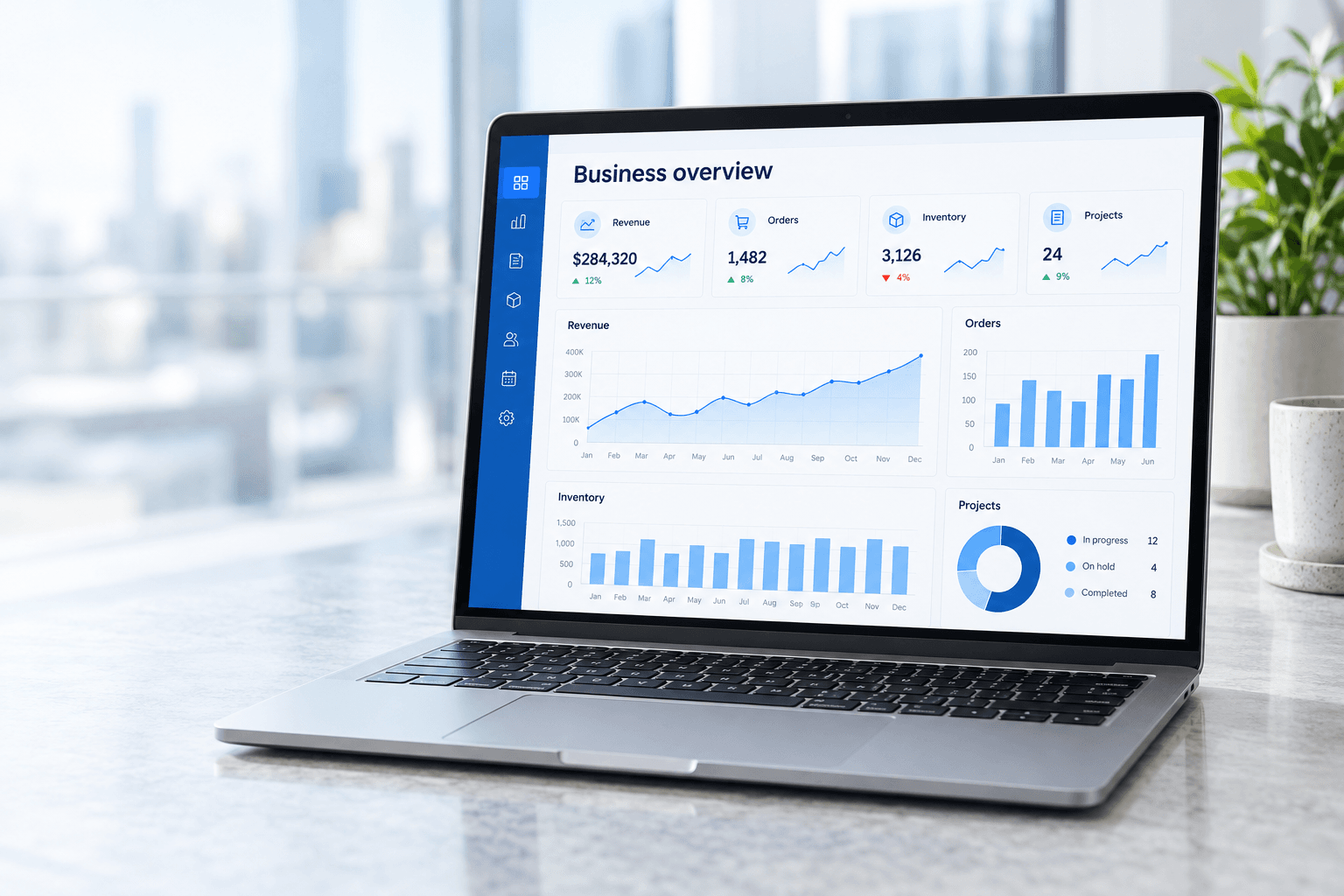 Laptop displaying an illustrative enterprise dashboard for finance, inventory and projects